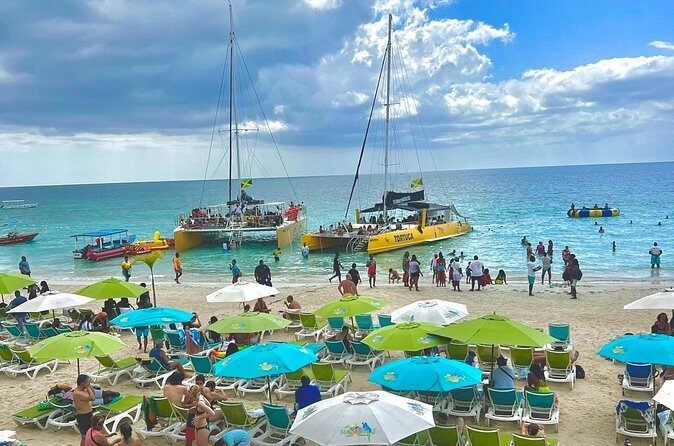 ATV Ride, Negril 7 mile Beach Catamaran Cruise & Ricks cafe Combo - Party catamaran cruise: snorkeling, DJ energy, and unlimited rum mixes