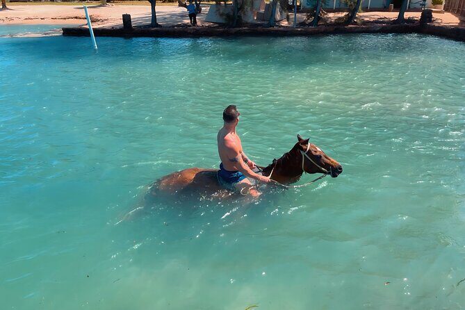 Bamboo Rafting & Horseback Ride n Swim Guided Tour In Montego Bay - Scotchies stop: a simple jerk-food break in the middle of the day