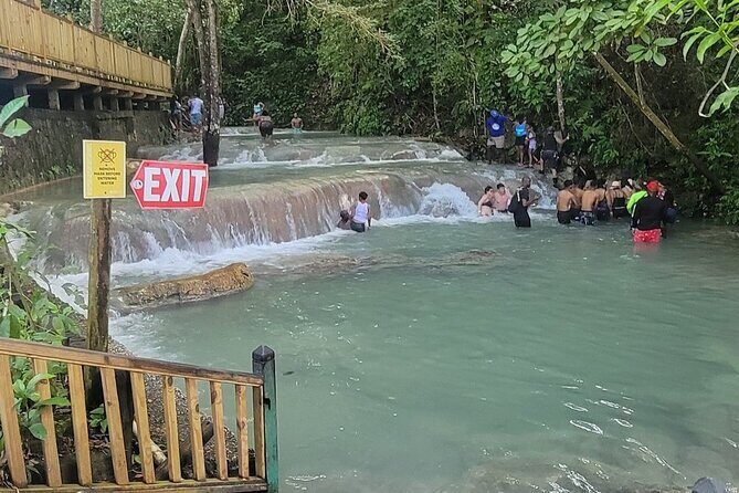 Blue Hole, Secret Falls & River Rapids Tubing from Montego Bay - Blue Hole: limestone sinkholes, rope swing, and fresh-water color