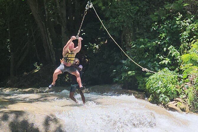 Bluehole and Bamboo Rafting from Montego Bay - Bamboo Avenue on the White River: calm rafting, captain entertainment, and optional limestone massage