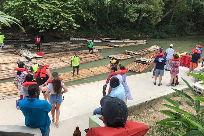 (Martha Brae River) Bamboo Rafting - Reaching the river site: life vest, welcome drink, and a smooth loading flow