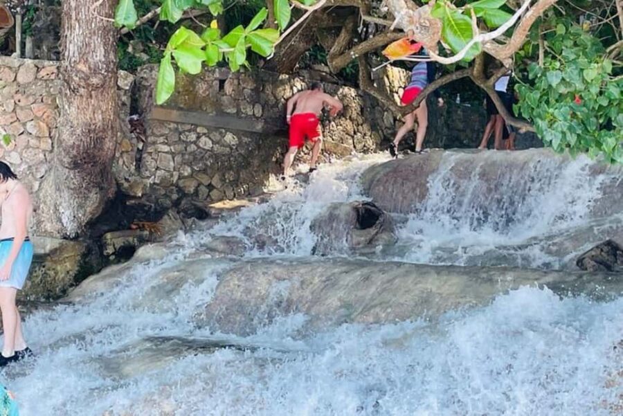 Montego Bay: Private Dunn's River Falls and Blue Hole Tour - Ocho Rios quick culture stops: history talk, local food options, and souvenir time