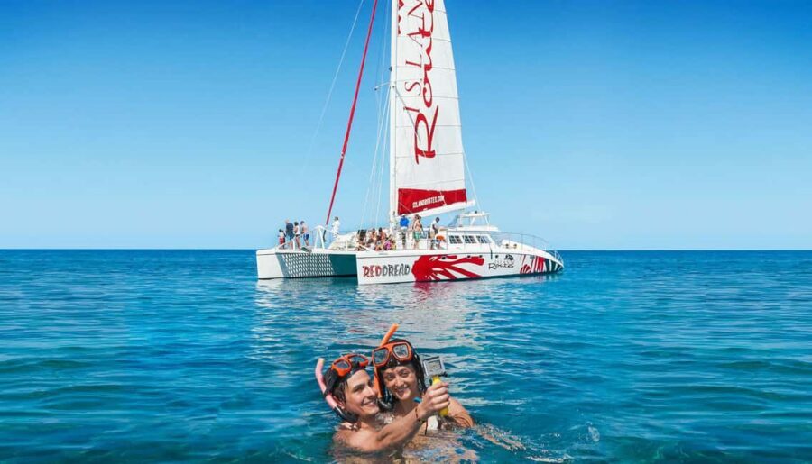 Montego Bay: Reggae Family Catamaran Cruise with Snorkeling - The Catamaran Ride: Reggae Beats, Snacks, and Kid-Friendly Extras