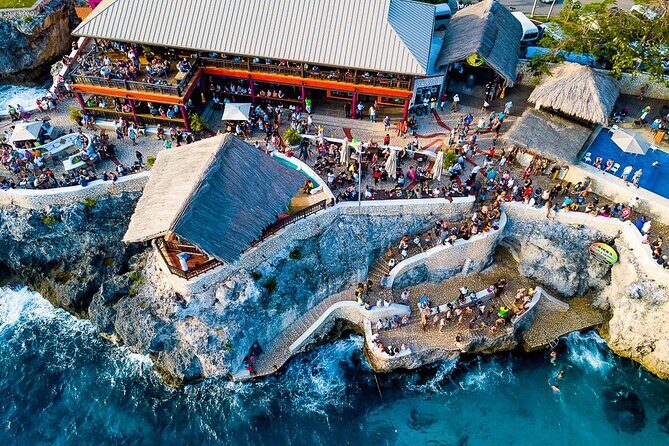 Negril 7 Mile Beach and Rick's Cafe Tour From Montego Bay Jamaica - Rick’s Café: Live Music and Cliff Jumps at Sunset