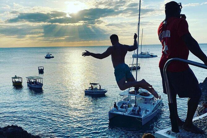 Negril 7 mile Beach, Party Catamaran Cruise , Snorkeling and Ricks Cafe Combo - Rick’s Cafe in the late day: sunset energy and cliff jumping