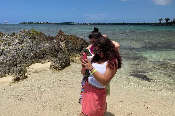 Negril Glass Bottom Boat Tour+Snorkeling visit Booby cay island - Seven Mile Beach starts the day: catamaran to the snorkeling island