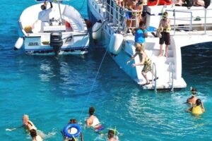 Party Catamaran and Snorkeling Tour in Montego Bay - The onboard party part: bar, snacks, music, and the crew