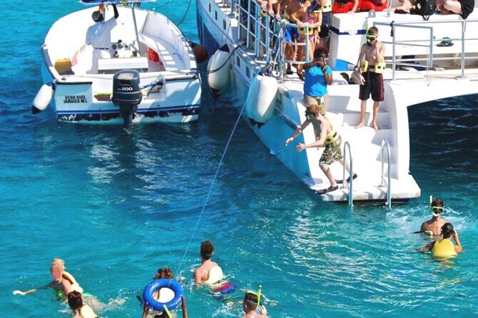 Party Catamaran and Snorkeling Tour in Montego Bay - The onboard party part: bar, snacks, music, and the crew