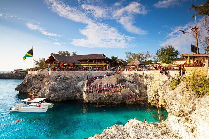 Private Trip to Blue Hole Mineral Springs, Negril & Ricks Café - Rick’s Cafe Sunset: Cliff Launchers, Reggae, and the Best Seat